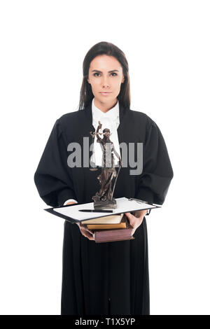 Judge in judicial robe holding themis figurine, books and clipboard isolated on white Stock Photo