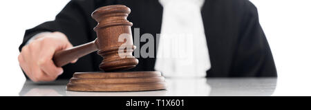 Panoramic shot of judge in judicial robe holding gavel isolated on white Stock Photo