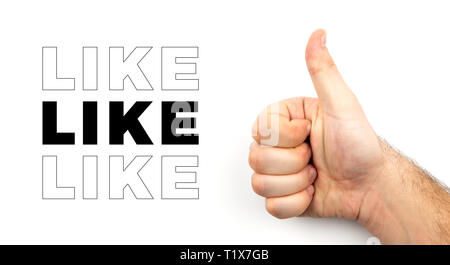 Male hairy hand shows thumb up and symbolizes approval sign, like, ok, good mood isolated on white background with space for text Stock Photo