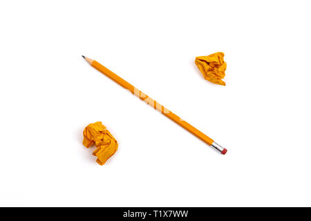 Illustrated percent sign from a pencil and two crumpled and crumpled sheets of paper on a white isolated background. Stock Photo