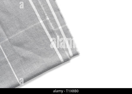 A piece of gray checked fabric is isolated on a white background with an area for text Stock Photo