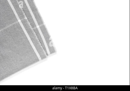 A piece of gray checked fabric is isolated on a white background with an area for text Stock Photo