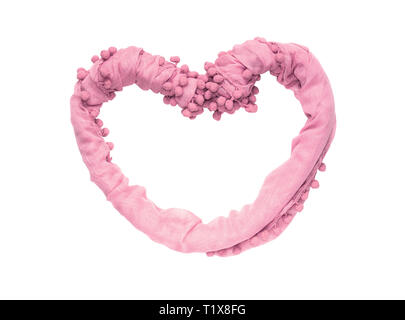 Frame in the shape of a heart of twisted delicate fabric of pink color isolated on white background. Stock Photo