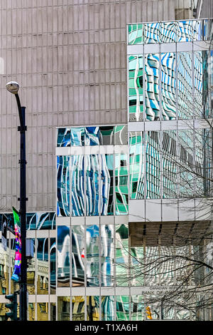 Office buildings reflected and distorted in nearby windows, downtown Vancouver, British Columbia, Canada Stock Photo