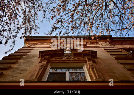 Sunset rays hitting the top of a building in Lviv, Ukraine Stock Photo