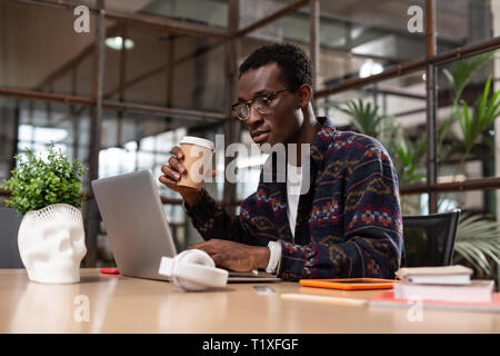 Man concentrated on doing important working task Stock Photo