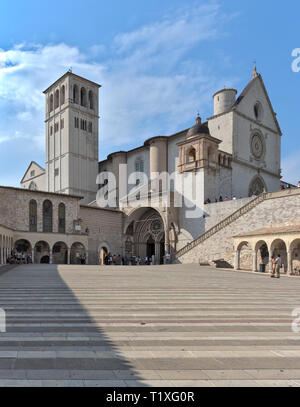 Assisi Umbria Italia - Italy. View from the Lower square of Saint Francis over the Basilica of Saint Francis of Assisi with crowd of pilgrims, tourist Stock Photo