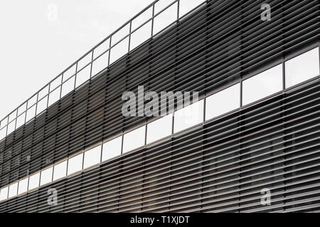 Perspective facade of a modern building - glass and steel with railing Stock Photo