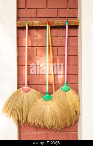 Hang broom on wall sales