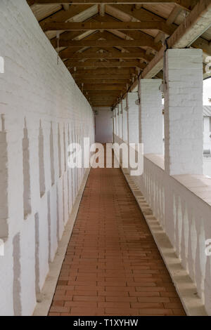 Long narrow corridor in an old building Stock Photo