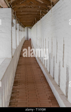 Long narrow corridor in an old building Stock Photo