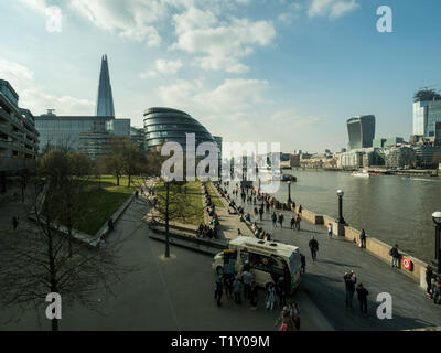 View towards The Shard (of Glass) skyscraper  & City Hall in the Southwark area of London, with the River Thames right, England. Stock Photo