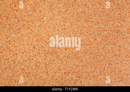 Horizontal texture from orange sand. Orange sand background. Stock Photo