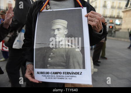 A picture of a protester's father who went missing during the Spanish dictatorship of Francisco Franco (1936-1975).  Around hundred people gathered in Madrid to protest against immunity for the crimes committed during the Spanish Civil War by Francisco Franco's dictatorship, and to demand justice for victims and relatives.