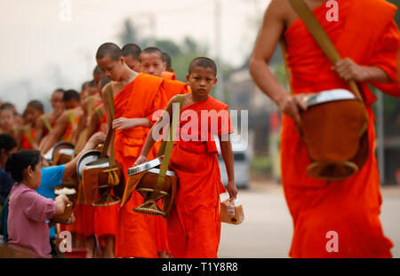 Luang Prabang. 29th Mar, 2019. Photo taken on March 29, 2019 shows a scene of Tak Bat (Alms giving) in Luang Prabang, Laos. Tak Bat is a tradition in Laos Buddhist culture. Credit: Wang Jingqiang/Xinhua/Alamy Live News Stock Photo