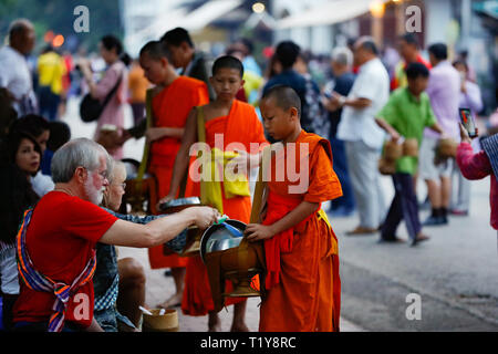 Luang Prabang. 29th Mar, 2019. Photo taken on March 29, 2019 shows a scene of Tak Bat (Alms giving) in Luang Prabang, Laos. Tak Bat is a tradition in Laos Buddhist culture. Credit: Wang Jingqiang/Xinhua/Alamy Live News Stock Photo