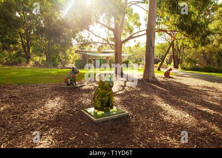 (190329) -- CANBERRA, March 29, 2019 (Xinhua) -- Koala statues are seen at the Australian National Botanic Gardens in Canberra, Australia, March 28, 2019. Fourteen one-meter-tall koala statues decorated by different artists are scattered across the Australian National Botanic Gardens, sitting on the ground for visitors to discover stories behind them on March 1-31.      The gardens' visitor experience coordinator Megan Donaldson said that the pop-up statues were aimed to raise awareness of Australian plants and native wildlife. (Xinhua/Pan Xiangyue)  TO GO WITH Feature: Exploring Australian Na Stock Photo