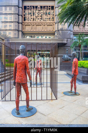 Italian sculptor Roberto Barni sculpture Clandestini at plaza of Parkview Square Singapore. Stock Photo