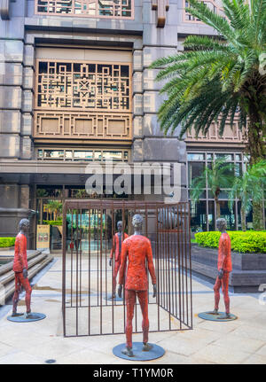 Italian sculptor Roberto Barni sculpture Clandestini at plaza of Parkview Square Singapore. Stock Photo