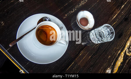 Espresso coffee in a white cup and saucer. Stock Photo