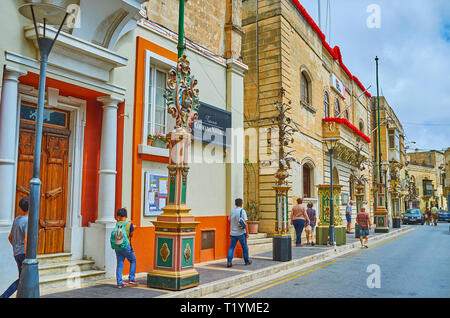 RABAT, MALTA - JUNE 16, 2018: The central streets and squares of the old town are richly decorated with garlands, floral compositions and lanterns due Stock Photo