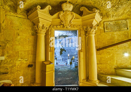 RABAT, MALTA - JUNE 16, 2018: The scenic stone gate with columns and carvings connects the ancient Grotto of St Paul with historical Wignacourt reside Stock Photo