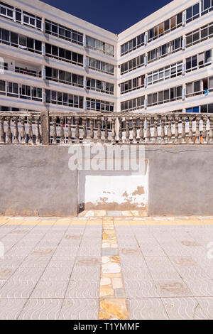 Decaying concrete balustrade and flats  at La Garita, Gran Canaria, Canary Islands Stock Photo