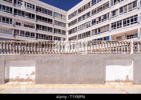 Decaying concrete balustrade and flats  at La Garita, Gran Canaria, Canary Islands Stock Photo