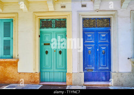 The colorful wooden doors and shutters of historical living edifices in Rabat, Malta. Stock Photo