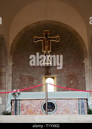Bevagna Umbria Italy Interior of the medieval church of San Michele Arcangelo. View over the altar with the antique crucifix 15th century Stock Photo