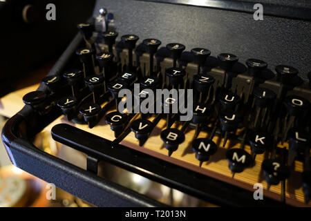 Details of an antique black typewriter in a museum Stock Photo