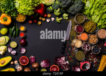 Various fruits and vegetables on black background. Copy Space Stock Photo