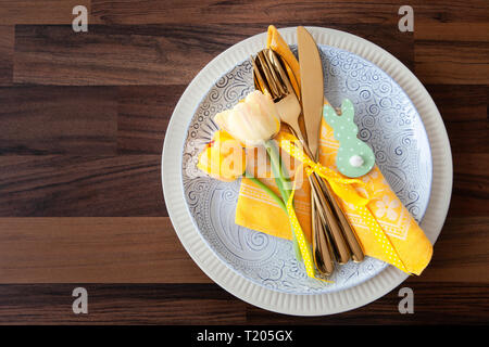 Festive table setting with fresh tulips for easter Stock Photo