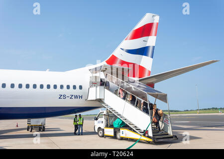 Passengers boarding Comair Boeing (British Airways) 737 aircraft at King Shaka International Airport (Durban), La Mercy, KwaZulu-Natal, South Africa Stock Photo