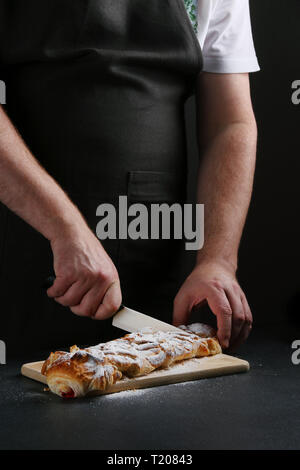 baker decorating on dark background. recipe concept. Stock Photo