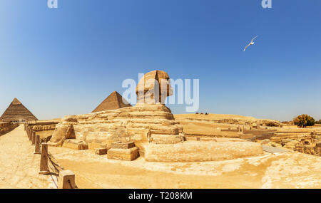Pyramids of Giza panorama, view on the Sphinx, the Pyramid of Cheops and the Pyramid of Chephren Stock Photo