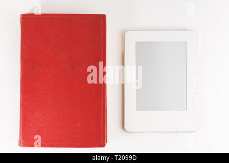 Digital e-book reader with a blank screen with old paper book isolated on white background Stock Photo