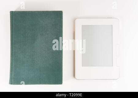 Digital e-book reader with a blank screen with old paper book isolated on white background Stock Photo
