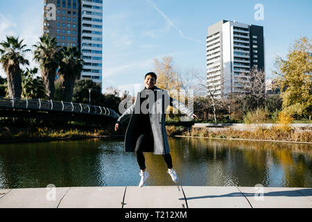 Spain, Barcelona, happy young man jumping in the air Stock Photo