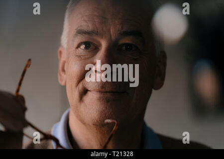 Portrait of smiling senior man Stock Photo