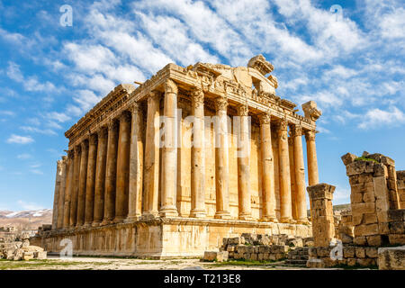 Ancient Roman temple of Bacchus with surrounding ruins with blue sky in the background, Bekaa Valley, Baalbek, Lebanon Stock Photo