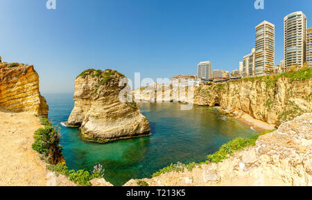 Raouche or pigeons rocks panorama with sea and ciry center in the background, Beirut, Lebanon Stock Photo