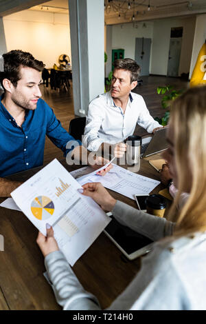 Business team having a meeting in loft office Stock Photo