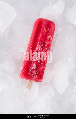 Strawberry popsicle on ice cubes. Top view. Stock Photo