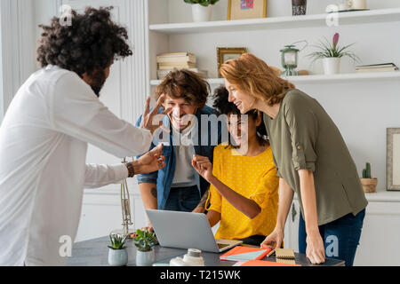 Young creative professionals working together in a cowrking space Stock Photo