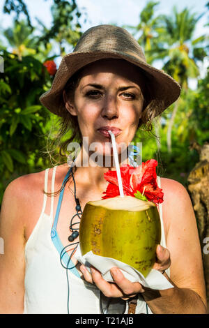 coconut drinking fresh woman water alamy nalaguraidhoo maledives ari atoll portrait sun island
