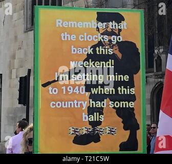 London, UK. 29th Mar, 2019. Brexit supporters demonstrate with a 'March to leave' for Britain's withdrawal from the EU. Among other things, they carry a poster with a man with a rifle and the inscription 'Remember that the clocks will be reset this weekend! I'm putting mine back to 1940, when the country still had eggs.' The protest march, which began on 16 March in Sunderland, North East England, ends on 29 March in Parliament Square, the day on which Brexit was originally scheduled to take place. Credit: Silvia Kusidlo/dpa/Alamy Live News Stock Photo