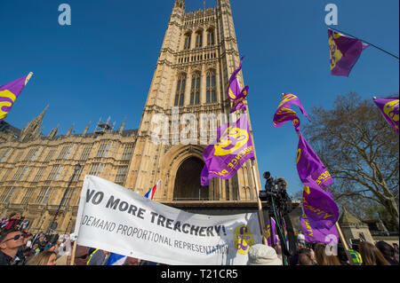 Westminster London, UK. 29 March, 2019. Thousands of Leave supporters gather outside Parliament as MPs reject the Prime Minister’s withdrawal deal by 58 votes. March to Leave rally gathers in Parliament Square to hear Nigel Farage speak. A separate Make Brexit Happen rally takes place in Whitehall, organised by UKIP with EDL’s Tommy Robinson. Image: UKIP supporters at College Green with the Victoria Tower of the Houses of Parliament as a backdrop. Credit: Malcolm Park/Alamy Live News. Stock Photo