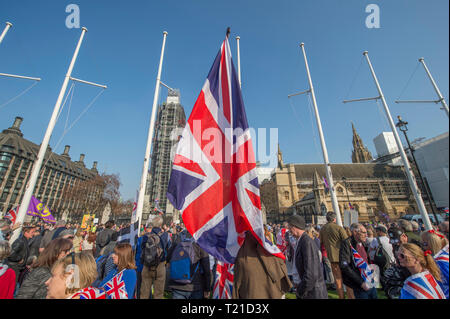 Westminster London, UK. 29 March, 2019. Thousands of Leave supporters gather outside Parliament as MPs reject the Prime Minister’s withdrawal deal by 58 votes. March to Leave rally gathers in Parliament Square to hear Nigel Farage speak. A separate Make Brexit Happen rally takes place in Whitehall, organised by UKIP with EDL’s Tommy Robinson. Credit: Malcolm Park/Alamy Live News.