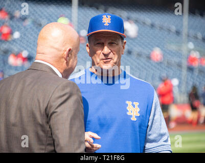 New York Mets bench coach Jim Riggleman (50) speaks with Washington Nationals General Manager and President of Baseball Operations Mike Rizzo prior to the game at Nationals Park in Washington, DC on Thursday, March 28, 2018. Riggleman managed the Nationals from 2009 to 2011. Credit: Ron Sachs/CNP (RESTRICTION: NO New York or New Jersey Newspapers or newspapers within a 75 mile radius of New York City) | usage worldwide Stock Photo